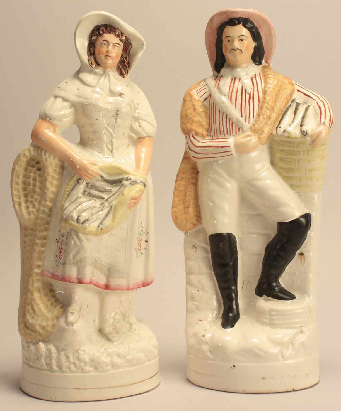 Appraisal: PAIR OF STAFFORDSHIRE FIGURESEnglish Mid- th CenturyA fisherman and a