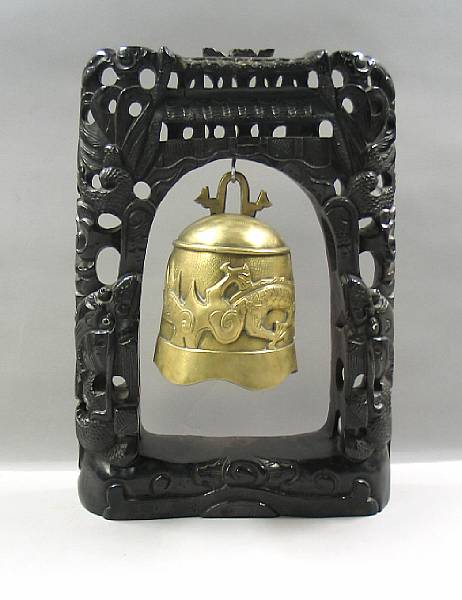 Appraisal: A Chinese bronze bell with a carved wood stand Decorated