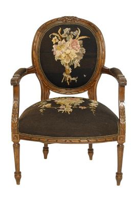 Appraisal: A French carved beechwood fauteuil having floral needlework upholstery early