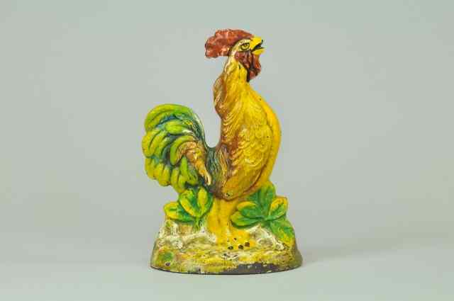 Appraisal: a CROWING ROOSTER DOORSTOP Depicts very colorful cast iron crowing