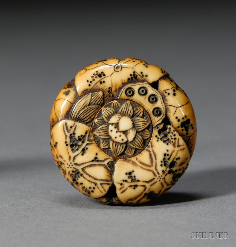 Appraisal: Ivory Netsuke th century Manju type surface carved with lotus