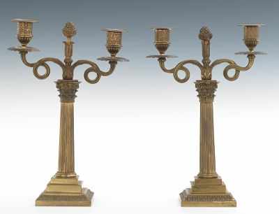 Appraisal: A Pair of Cast Brass Candle Holders Two-candle holders with