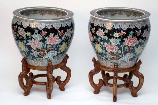 Appraisal: Pair of Chinese ceramic fish bowls with wooden stands Decorated