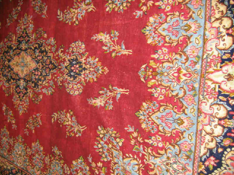 Appraisal: KIRMAN ROOM RUG The rich red field of floral design