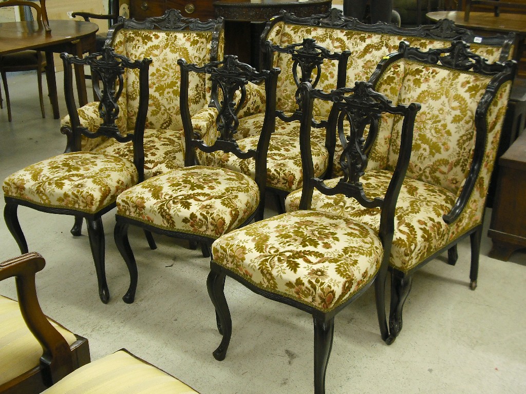 Appraisal: Late Victorian ebonised seven piece salon suite comprising a two