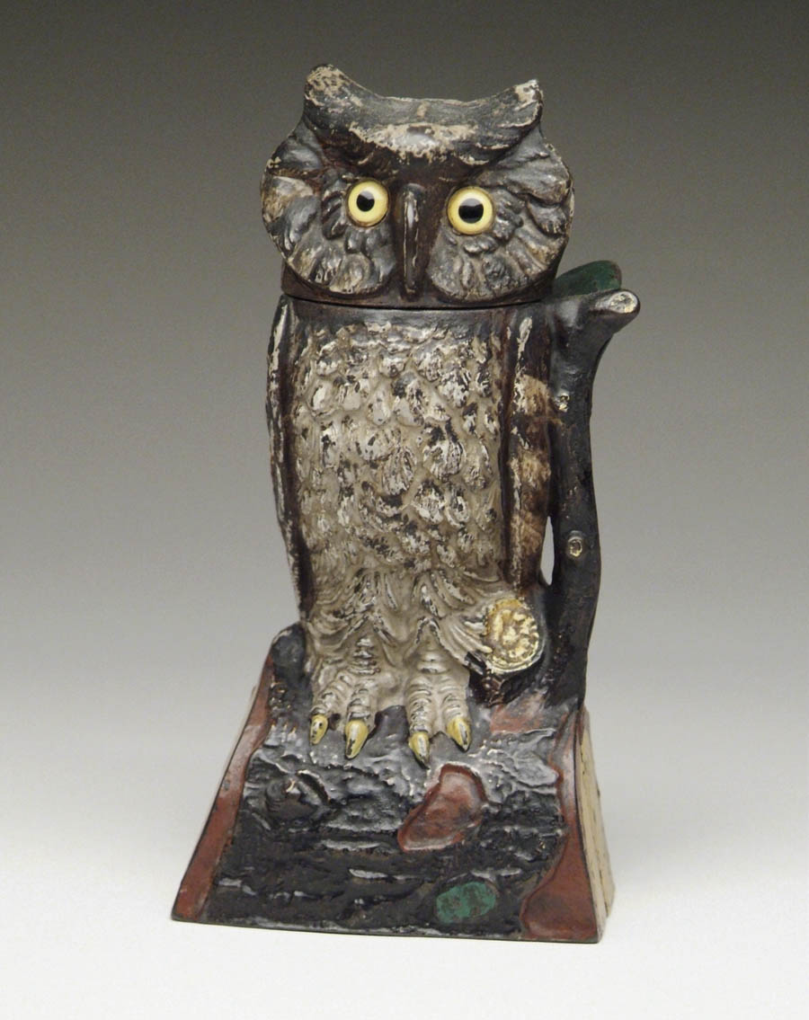 Appraisal: OWL TURNS HEAD MECHANICAL BANK Place penny on branch compress