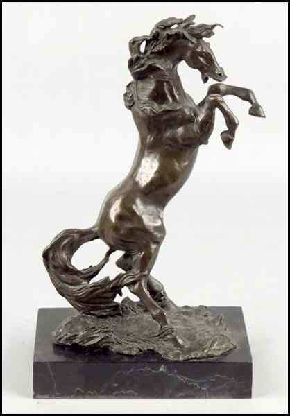 Appraisal: PATINATED BRONZE FIGURE OF A REARING HORSE Raised on a