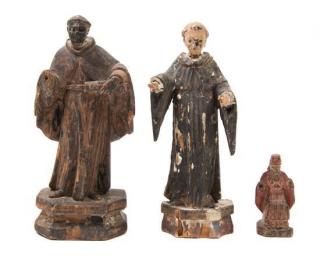 Appraisal: Three Carved Wood Santos Figures th th century depicting various