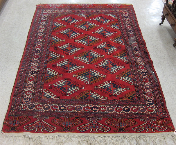 Appraisal: PERSIAN TURKOMAN BOKHARA AREA RUG hand knotted in a repeating