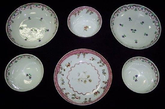 Appraisal: A pair of tea bowls and saucers decorated flower sprays