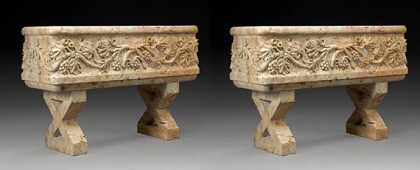 Appraisal: A pair of Neoclassical style carved travertine jardini res Of