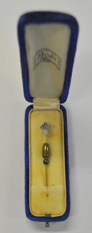 Appraisal: Stick pin set small square sapphire in white and yellow