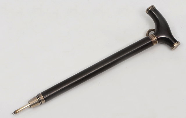 Appraisal: AN ANTIQUE WHITE METAL MOUNTED PROPELLING PENCIL in the form