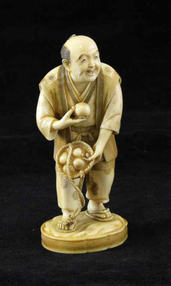 Appraisal: A Japanese ivory figure of a Persimmon seller early th