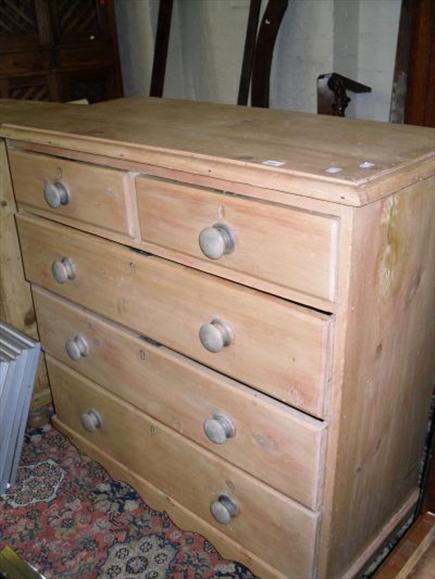 Appraisal: A stripped pine chest on two short and three long