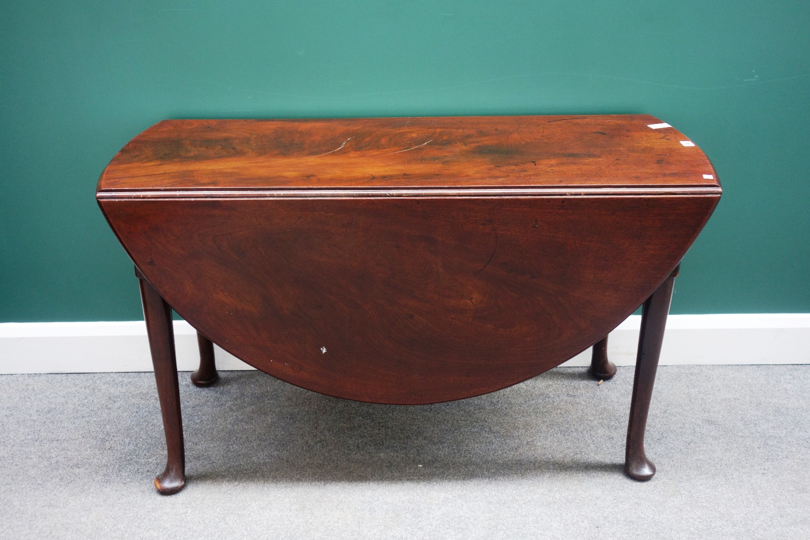 Appraisal: A mid th century mahogany drop flap dining table on