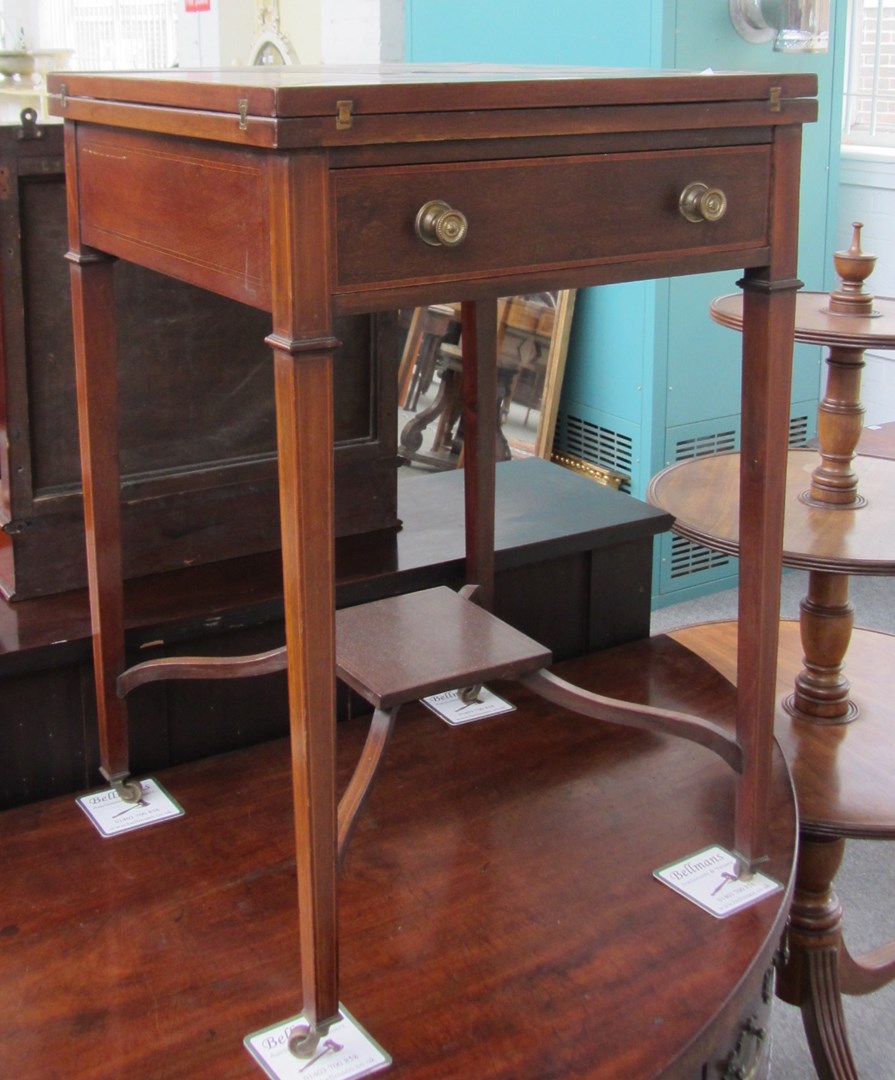 Appraisal: An Edwardian Kingwood banded mahogany envelope card table with single