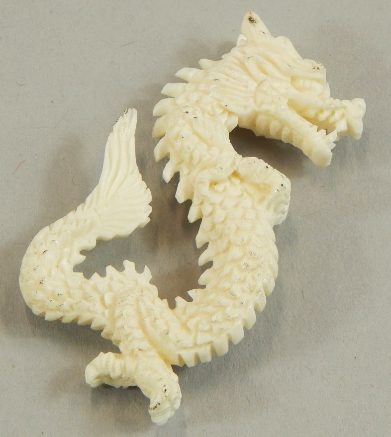 Appraisal: A fine bone carving of a dragon cm