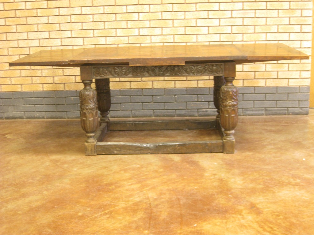 Appraisal: An th Century style oak Drawleaf Table carved bulbous legs