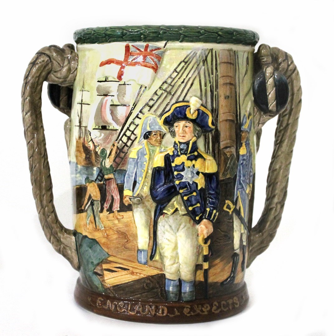 Appraisal: A Royal Doulton loving cup by Charles Noke commemorating Lord