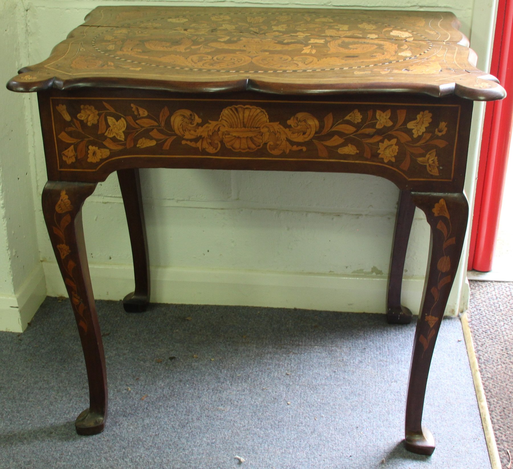 Appraisal: A th Century Dutch marquetry side table the shaped top