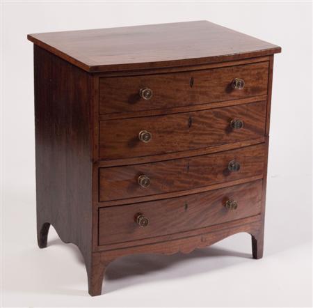 Appraisal: A Regency mahogany bowfront bachelor's chest the crossbanded top over