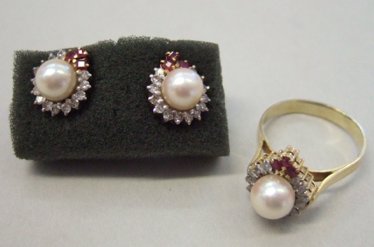 Appraisal: A cultured pearl diamond and ruby set ring mounted with