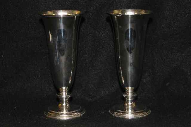 Appraisal: A PAIR OF SILVER CHAMPAGNE FLUTES with tapering cylindrical bodies