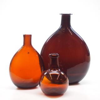 Appraisal: Free Two free-blown glass chestnut flasks diminutive bottle Medium to