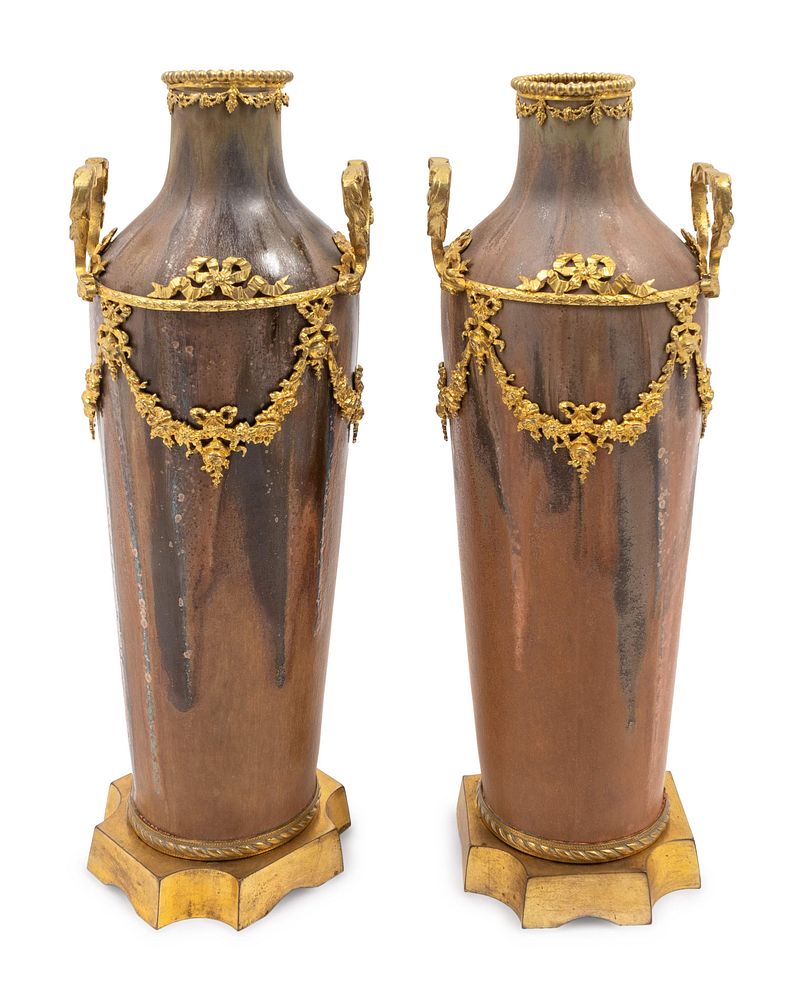 Appraisal: A Pair of Louis XVI Style Gilt-Metal-Mounted Pottery Vases Height