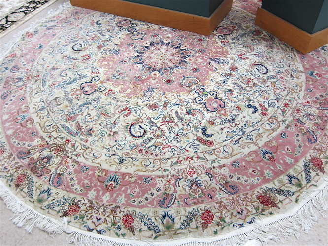 Appraisal: ROUND ORIENTAL WOOL AND SILK CARPET a high quality Indo-Persian