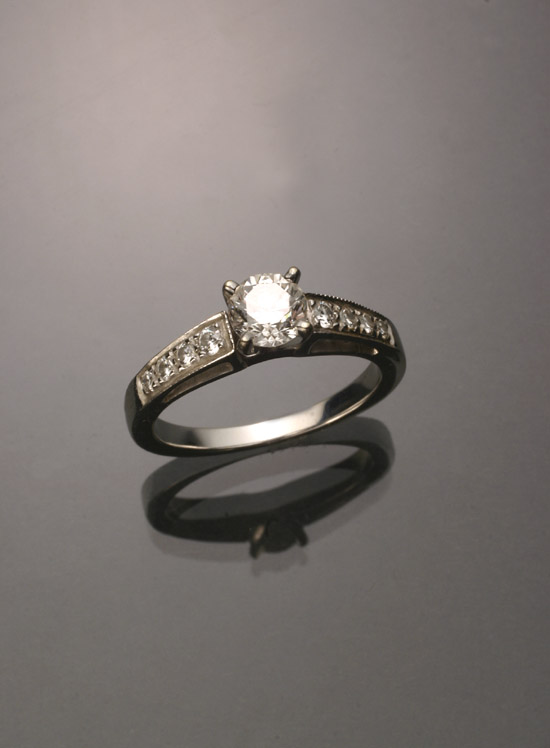 Appraisal: -Karat White-Gold Solitaire Diamond Ring The four-prong Tiffany-type mount set