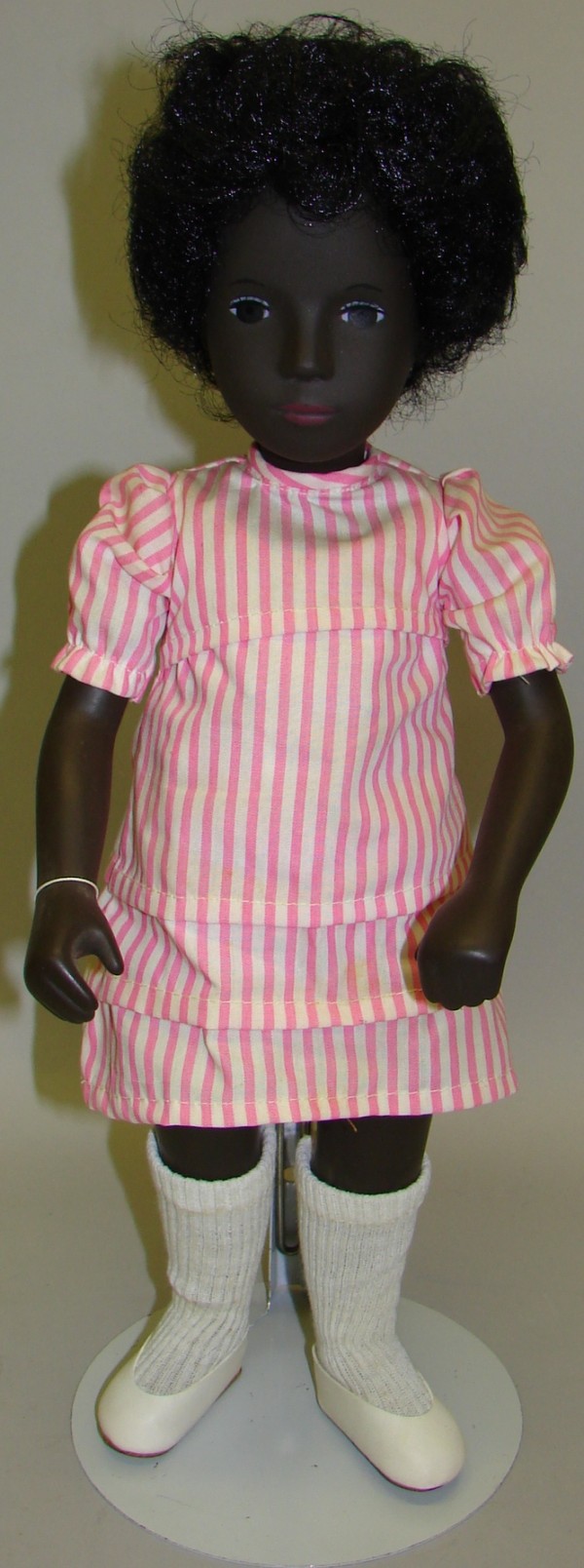 Appraisal: Black Cora child with curly black hair Original outfit pink