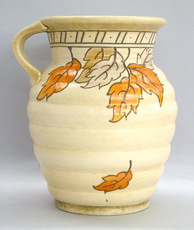 Appraisal: Charlotte Rhead Crown Ducal 'Golden Leaves' ovoid ribbed jug pattern