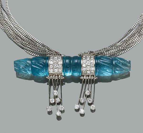 Appraisal: An aquamarine and diamond necklace featuring an elongated carved aquamarine