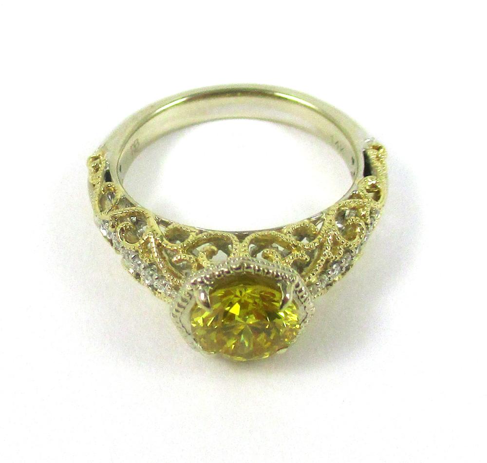 Appraisal: FANCY YELLOW DIAMOND AND FOURTEEN KARAT GOLD RING The k