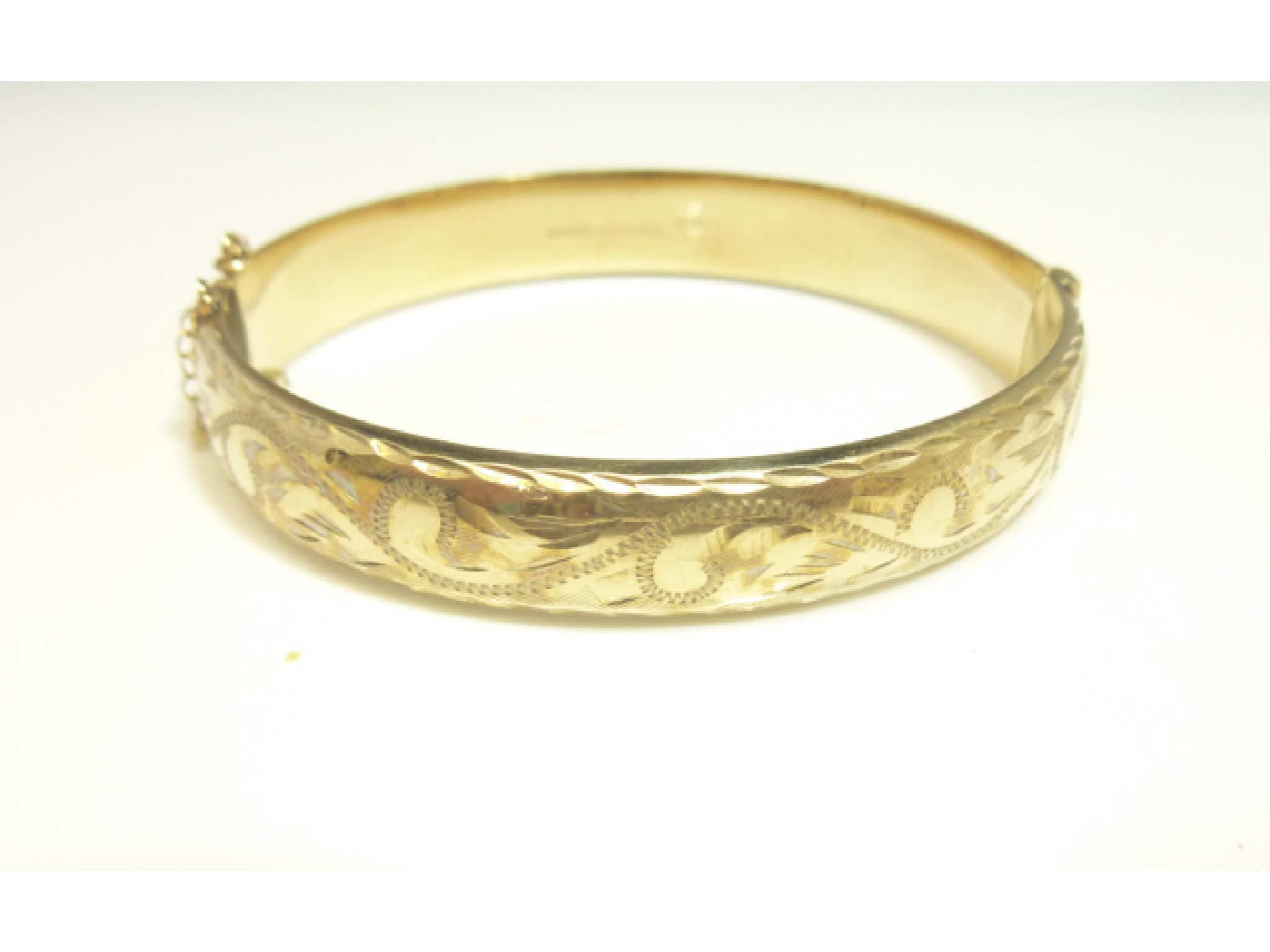 Appraisal: A ct gold hinged bangle with bright-cut decoration g