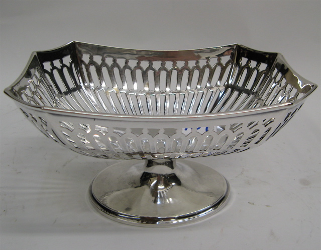 Appraisal: TWO GERMAN FINE SILVER CANDY DISHES a rectangular form pierced