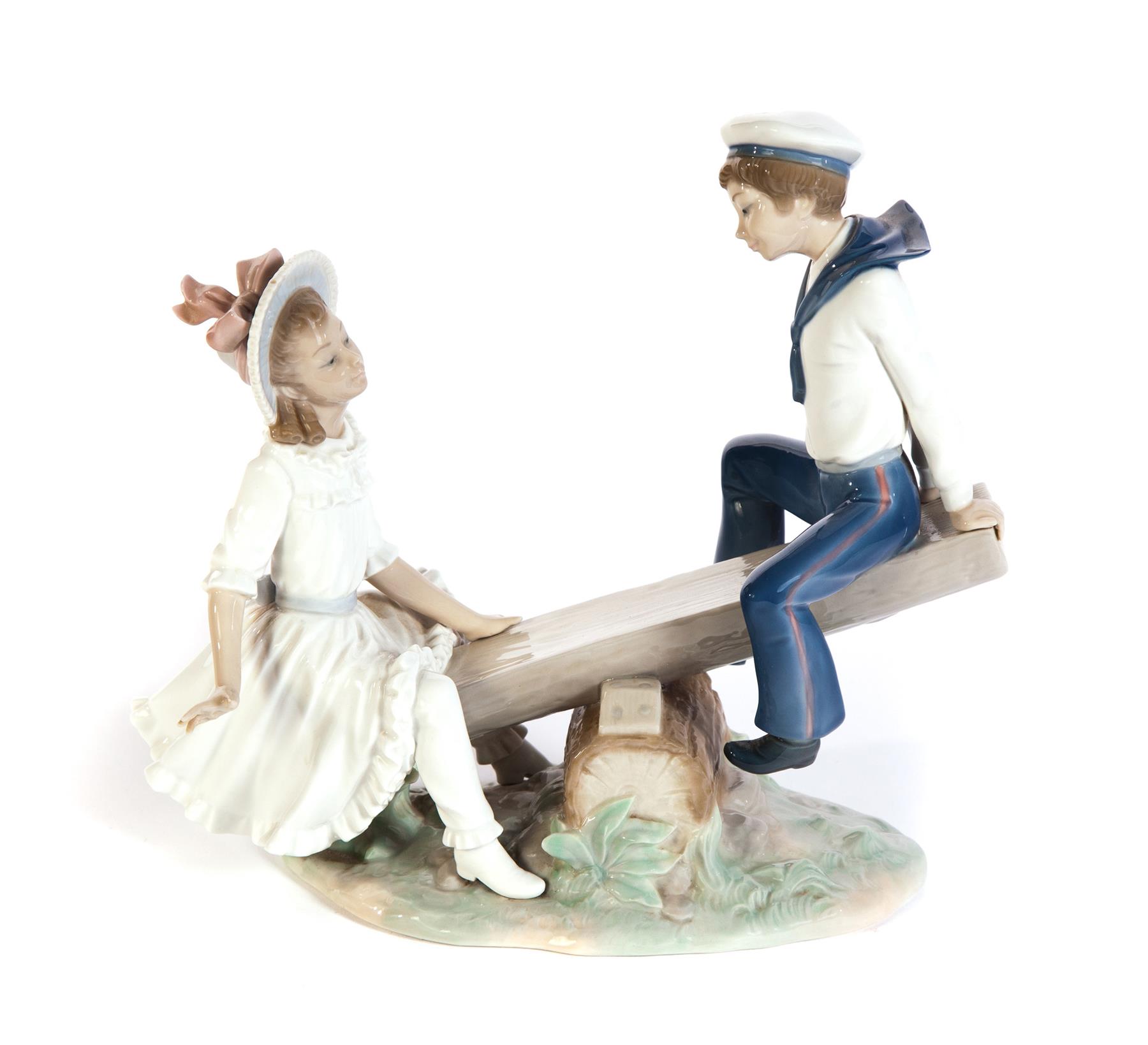 Appraisal: LLADRO FIGURAL GROUP OF GIRL AND BOY ON A TEETER-TOTTER