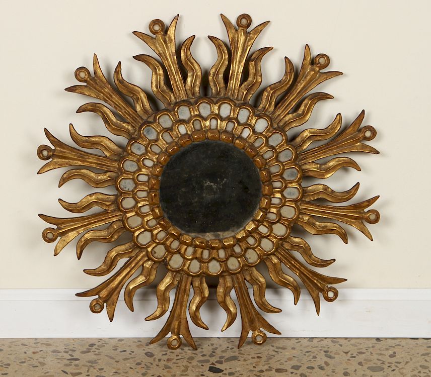 Appraisal: GILT WOOD SUNBURST MIRROR MANNER LINE VAUTRIN A gilt wood