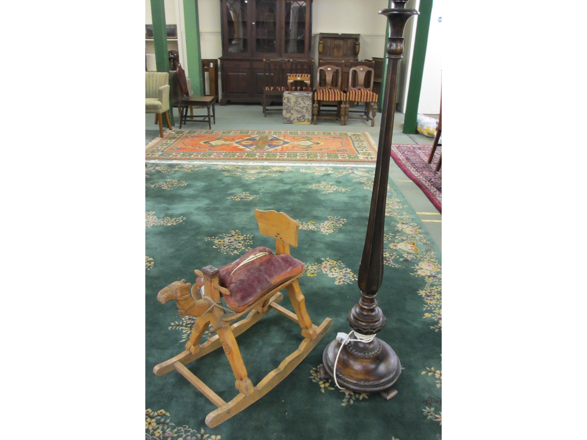 Appraisal: A stained standard lamp and camel rocking chair