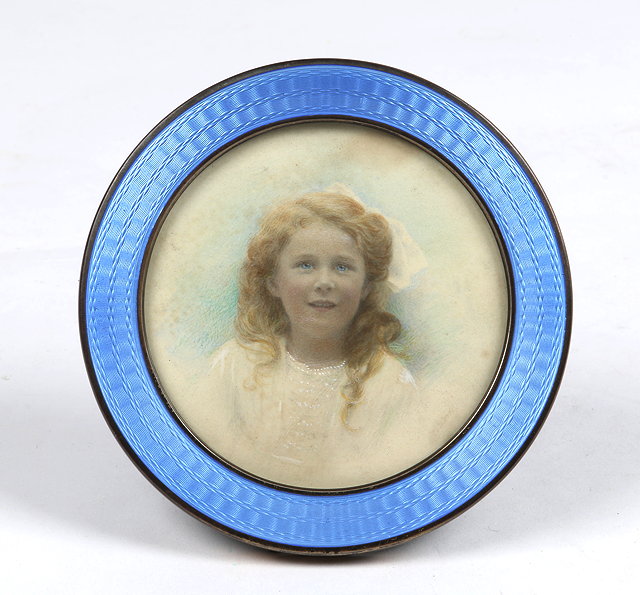 Appraisal: A CIRCULAR SILVER AND ENAMEL PHOTO FRAME cm diameter London