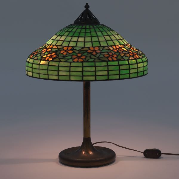 Appraisal: UNIQUE LEADED GLASS LAMP H x W Simple cast metal