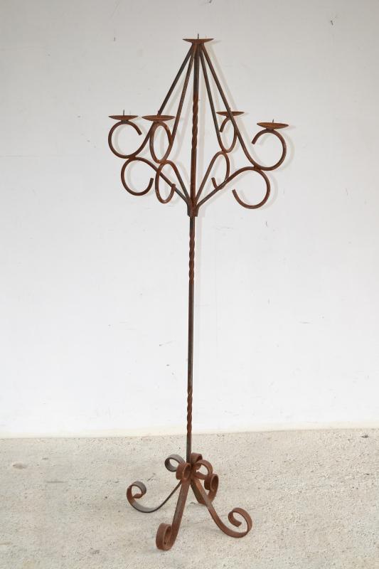 Appraisal: A RUSTIC WROUGHT IRON FIVE BRANCH CANDELABRA A RUSTIC WROUGHT