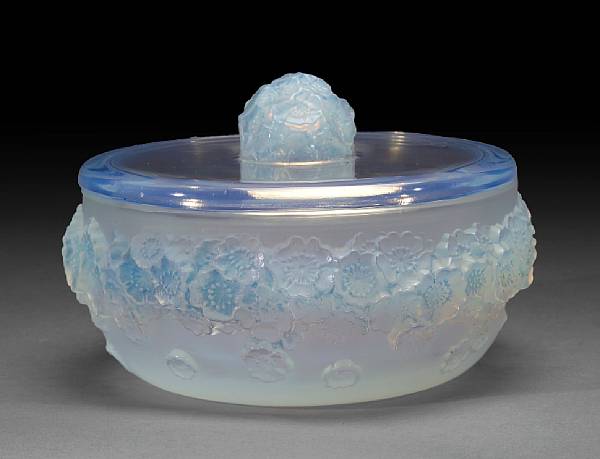 Appraisal: A Ren Lalique molded opalescent glass covered box Primev res