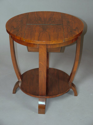 Appraisal: An Art Deco walnut veneered circular two tier work table