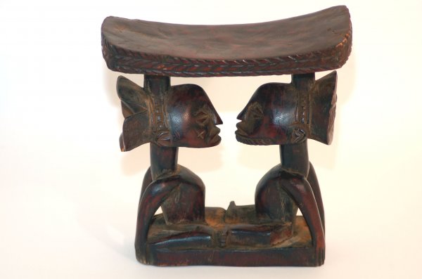 Appraisal: Luba twin caryatid headrest the slightly curved top with carved