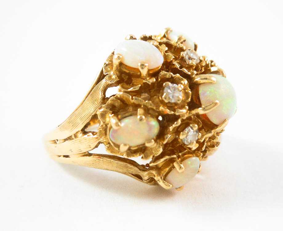 Appraisal: OPAL DIAMOND AND FOURTEEN KARAT GOLD RING with six oval