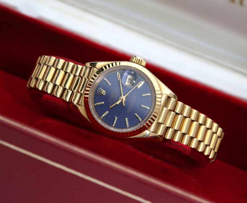 Appraisal: Circular blue dial with date aperture and gold tone baton