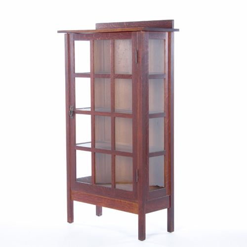 Appraisal: GUSTAV STICKLEY Single-door china cabinet with twelve panes on front